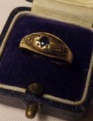 A hallmarked 18ct Gold Ring, set with a centre Mid-Blue Sapphire within an engraved surround