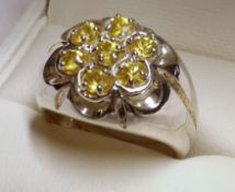 A hallmarked Silver Dress Ring set with seven Yellow “Created Sapphires”