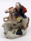 A 19th Century Staffordshire Figure, John Gilpin, modelled as a figure on horseback, decorated