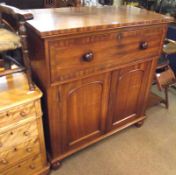 A Victorian Mahogany Secretaire Cabinet, the single dummy drawer front opening to reveal a fitted