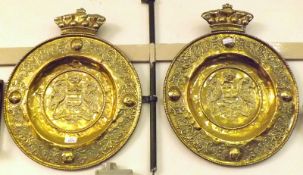 A pair of large Brass Armorial Wall Plaques, the centres embossed with armorials with coronet