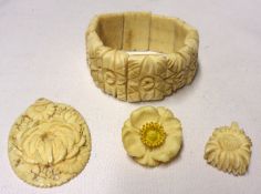 A Mixed Lot including an early 20th Century Oriental Carved Ivory Pendant with chrysanthemum design;