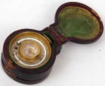 A late 19th Century morocco cased Combination Pocket Barometer/Altimeter/Thermometer/Compass,
