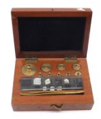 A mahogany cased set of Metric Weights, L Oertling –London, of typical form in a fitted case with