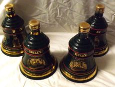 Four Wade Decanters comprising: Christmas 1992, 1993, 1994, 1995