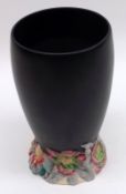 A Clarice Cliff “My Garden” Vase, black body and coloured floral embossed foot, 6” high