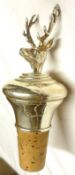 A Queen Elizabeth II Bottle Stopper, modelled as a stag’s head on a tapering cork-mounted base,