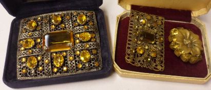 A group of three early 20th Century Filigree Metal and yellow paste mounted Brooches, two