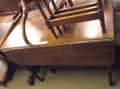 A Victorian Mahogany Pembroke Drop Leaf Table with single drawer, raised on turned legs and brass