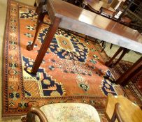 A Caucasian Carpet with triple gull border, central panel of large cruciform lozenge, mainly brown