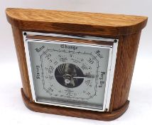 A late 20th Century Aneroid Barometer, the plinth-shaped case with crown bezel and square silvered