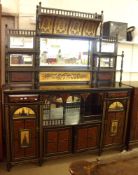 An Arts & Crafts/Aesthetic period Mirror Backed Side Cabinet with galleried pediment over painted