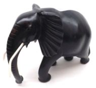 A large African Ebony Model of a bull elephant, 14” long  350-70