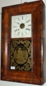 A late 19th Century American Walnut Wall Clock, Ansonia, the rectangular case with cushion moulded