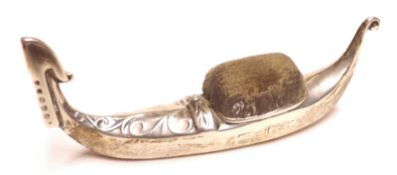 An early 20th Century Novelty Pin Cushion in the form of a Gondola, 3” long, marks heavily rubbed