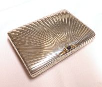 A Continental white metal Cigarette Case, the hinged ribbed sunburst lid inset with Hardstone
