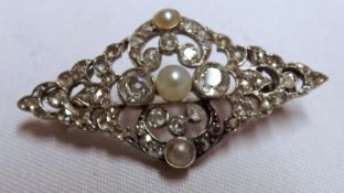 A late 19th/early 20th Century precious metal openwork Brooch of lozenge shape, all Diamond set with