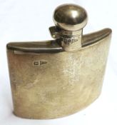 A small Hip Flask of curved form, inscribed “Presented to Commander E.P.S. Parr OBE VRD Royal Navy