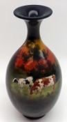 A Doulton Burslem Holbein Ware narrow necked Baluster Vase, decorated with grazing cattle at sunset,