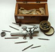 A Clockmakers Lathe Tool with triangular bed and tool rest, with assorted tools and attachments,