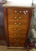 A Mahogany Wellington Chest, rectangular top with moulded edge over seven graduated drawers and