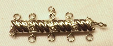 A mid-grade white metal Bracelet or Necklace Clasp of bar form, stamped “14K,585”, 33mm wide