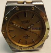 A Gents circa 1980s Seiko Quartz-SQ Sports 100, stainless steel cased Wristwatch with gold batons to