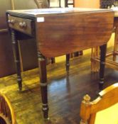 An early Victorian Mahogany Drop Leaf Pembroke Table of typical form, the top with moulded edge,
