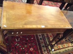 A late 19th Century Mahogany Fold Top Card Table, crossbanded and boxwood strung top over a plain