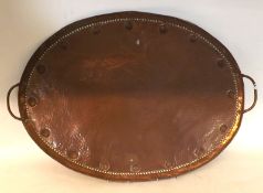 An early 20th Century Copper Two Handled Oval Large Tray, with embossed rim, the base stamped JP,