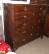 An early 19th Century Mahogany Chest of two short and three long drawers, fitted with oval brass