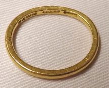 A hallmarked 22ct Gold Wedding Ring, weighing approximately 2 ½ gm (misshapen)