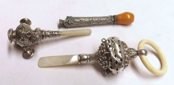 Two Victorian Mother-of-Pearl handled Babies Rattles of typical form, one lacking ring to top;