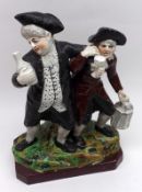 A 19th Century Staffordshire Figure Group, Vicar and Moses, raised on a square plinth base,