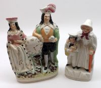 A Mixed Lot: a Staffordshire Clock Group modelled as a couple in period dress, decorated in colours,