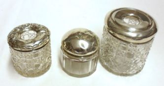 A Mixed Lot: two Hair Tidy Jars with hallmarked tops and cut clear glass bodies, and a further