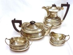 A George V Four Piece Tea Service, comprising Teapot with ebonised handle and lid finial to the