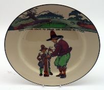 A Royal Doulton Golfing Plate, decorated with a scene of golfers and course and motto “Give Losers