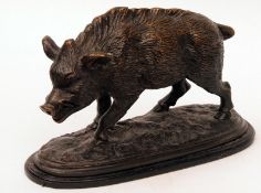 A Patinated Bronze Model of a wild boar, raised on a naturalistic oval plinth base, 10” long