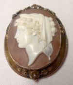 A Victorian Gold Framed Shell Cameo Brooch of a classical lady (hairline crack), 50mm x 40mm