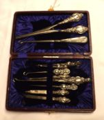 A Cased Composite Set of Manicure Items, Glove Stretchers and Button Hooks, various dates and makers