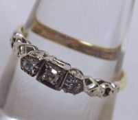 An early 20th Century 18ct Gold and Platinum three small Old Cut Diamond Ring with pierced