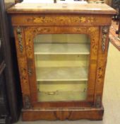 A Victorian Walnut Pier Cabinet, with moulded edge over frieze door and sides inlaid with panels