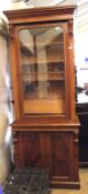 A Victorian Mahogany Side Cabinet of narrow proportions with moulded cornice over central arched