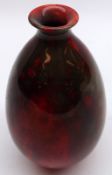 A Royal Doulton Flambé narrow necked Baluster Vase, with marbled design, initialled HE to base, 6”