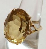 A large circa 1970s high grade yellow metal Dress Ring set with large cut oval Citrine (measuring