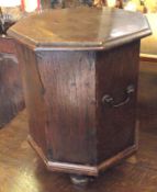 A 19th Century Oak Octagonal Flip Top Wine Cooler, with swan neck handles to sides, raised on