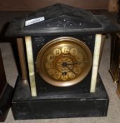 A late 19th Century Black Marble Garniture comprising a central Timepiece with circular face and