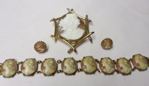 A Mixed Lot comprising: a Victorian tubular Gold framed large Shell Cameo Brooch of a classical