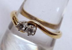 A hallmarked 18ct Gold two small Brilliant Cut Diamond Ring of crossover design